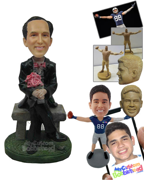 Sophisticated Smart Man Sitting in Formal Dress with Legs Folded and Hands Wrapped Around a Bouquet Personalized Bobblehead