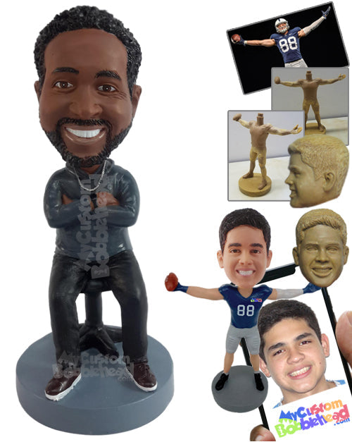 Nice looking male sitting on a computer chair with arms crossed, having a chill time Personalized Bobblehead