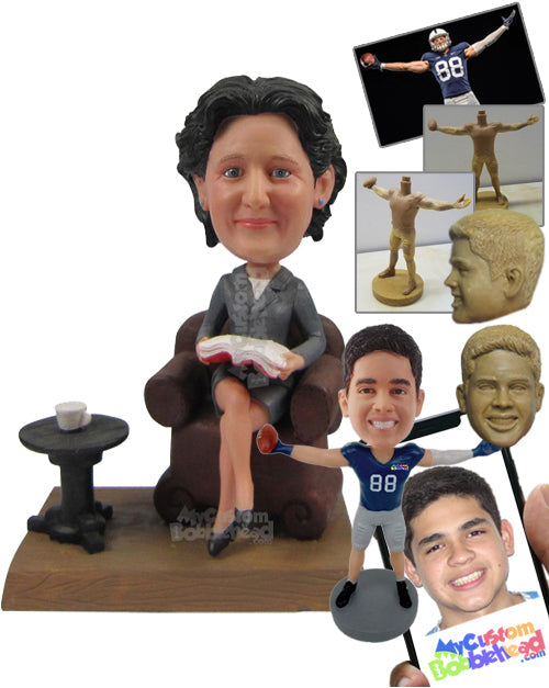 Lady Wearing Jacket Sitting on a Couch Reading a Book and Having a Cup of Tea Personalized Bobblehead